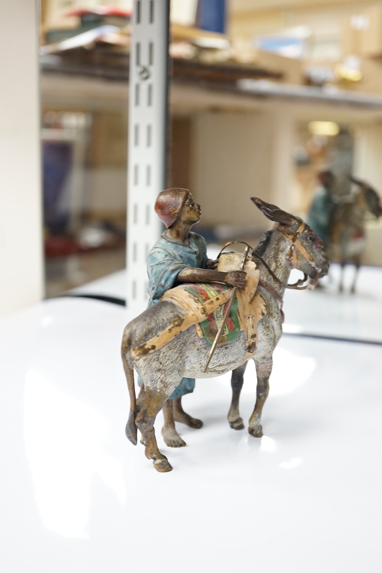 A Viennese cold painted bronze of an Arab trader with mule, 14cm high, 13cm wide. Condition - slight chipping to painted areas